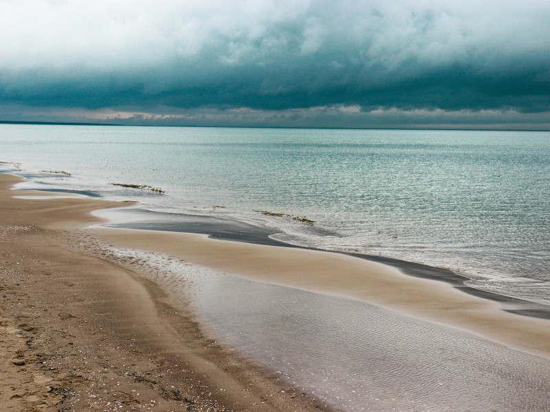a beach with a body of water