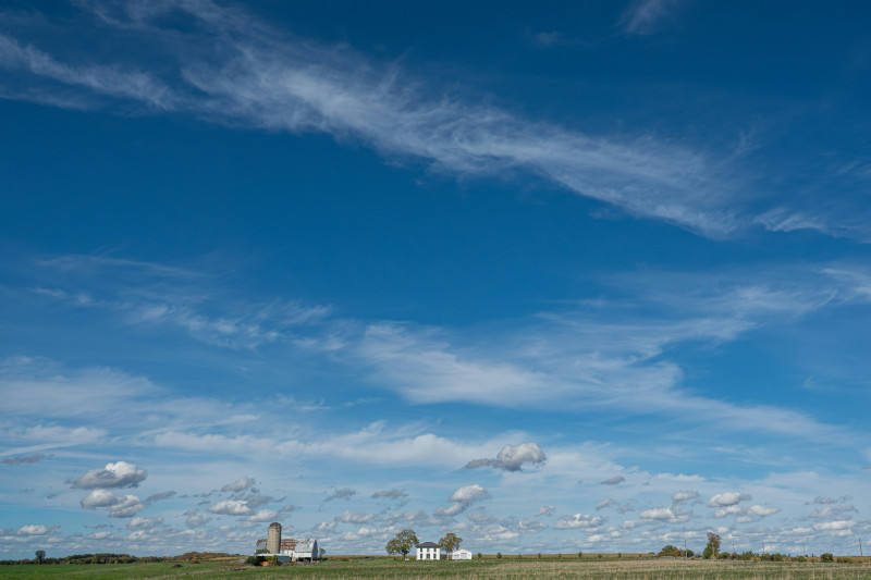 a farm under brilliant skies