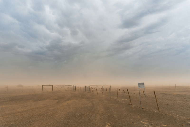 We just passed the border between South Africa and Namibia and it started raining. Someone at the border post told us it was the first time in 2 years. We drove a bit further and the rain turned into a sand storm, this picture was taken while the storm lu