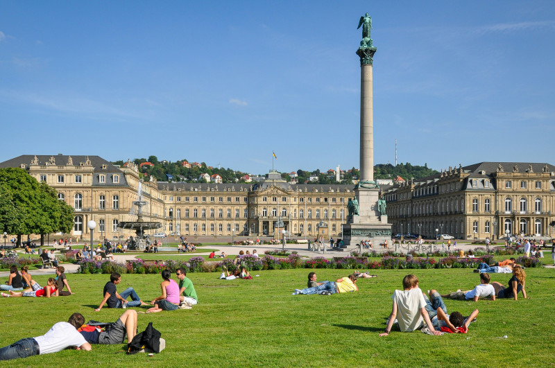 Sunny Summer Day at Schlossplatz Square with People Relaxing in Front of the New Palace in Stuttgart