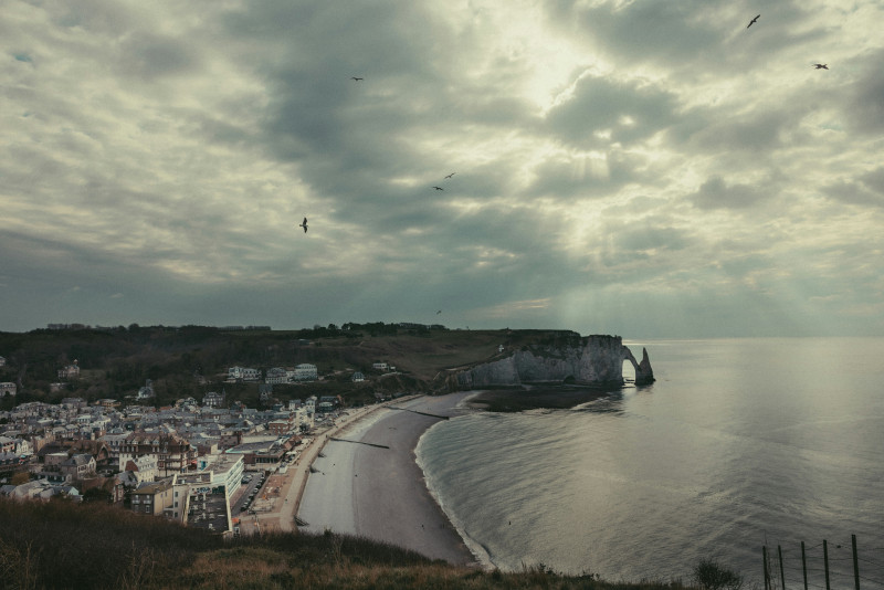 Coastal town sits next to a cloudy sea