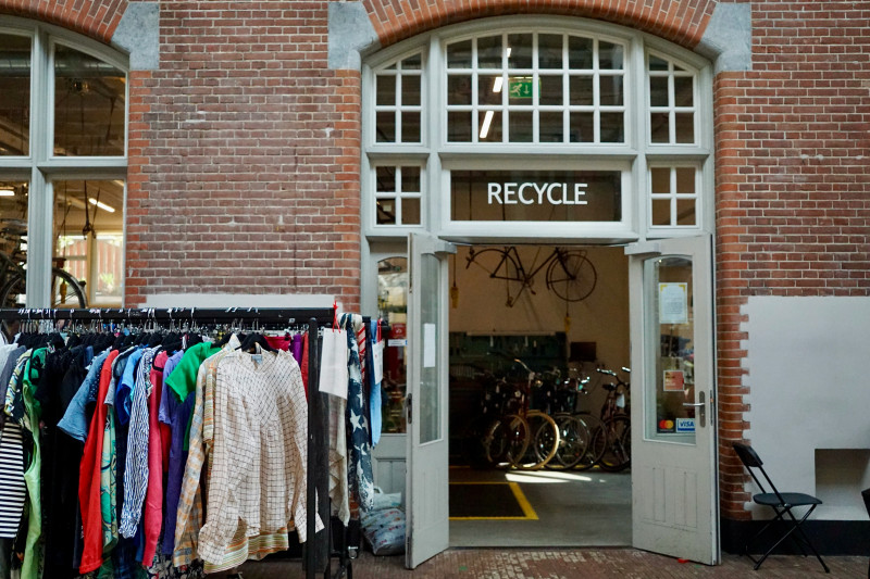 Recycle center with clothes and bicycles inside
