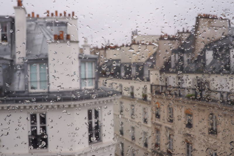 Raindrops forming on the window outside our hotel in Paris.