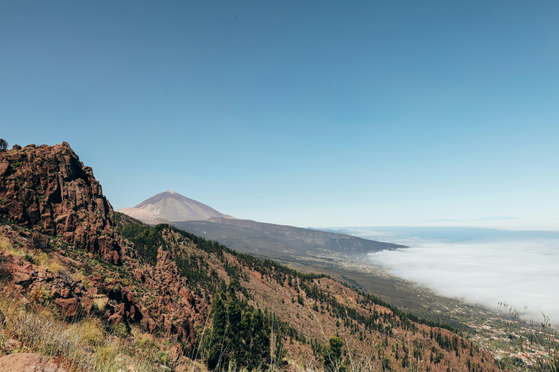 Mountain landscape with a clear blue sky and clouds