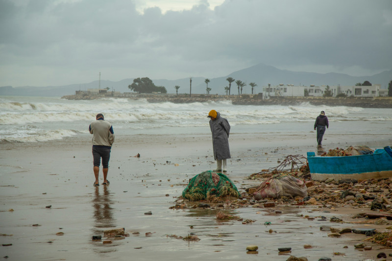 Fisherman is seen at the beach after heavy rains in Tunis on January 21, 2026. Flooding in Tunisia has killed four people, authorities said January 20, as schools and businesses were forced to close after parts of the country experienced their heaviest ra